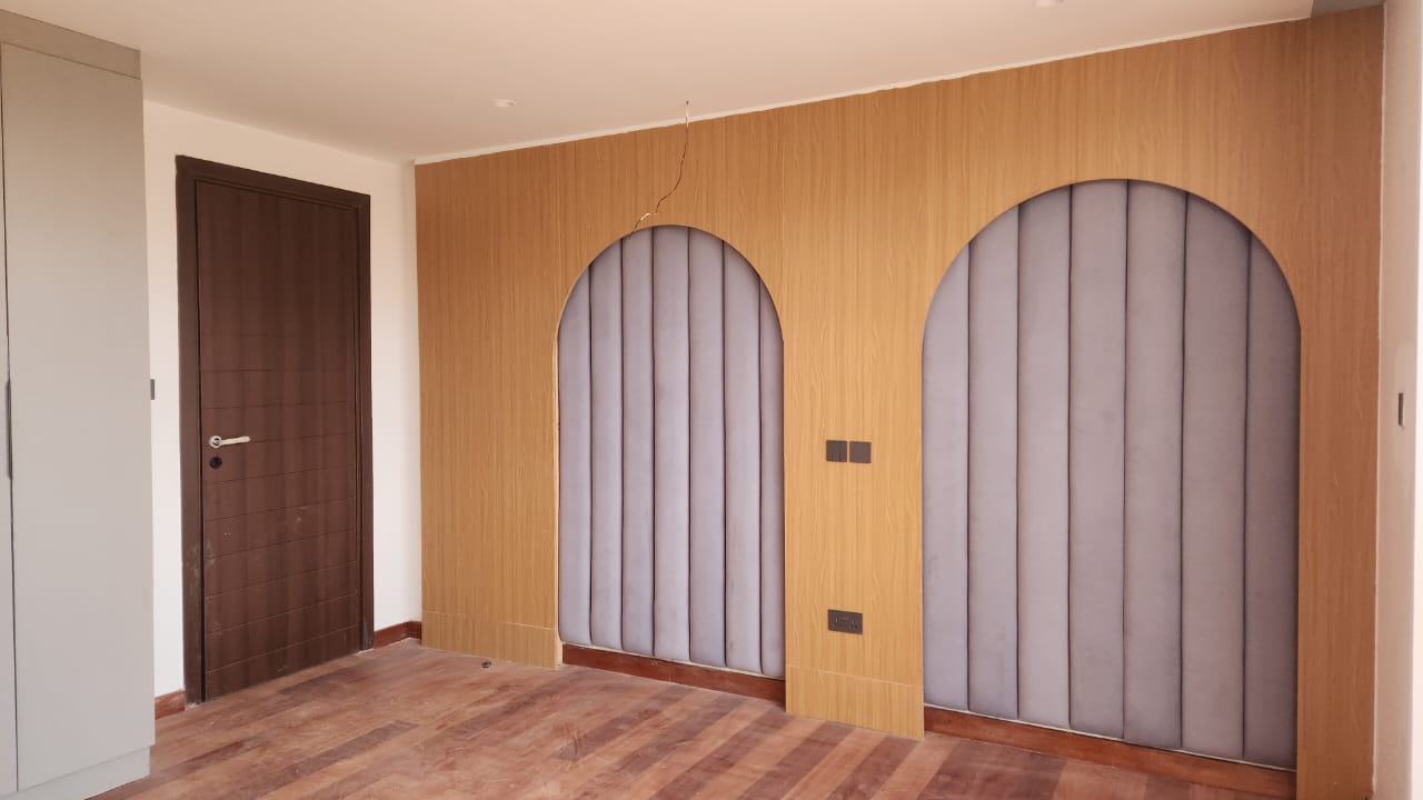 Interior fitting showcase with feature wall and upholstered panels