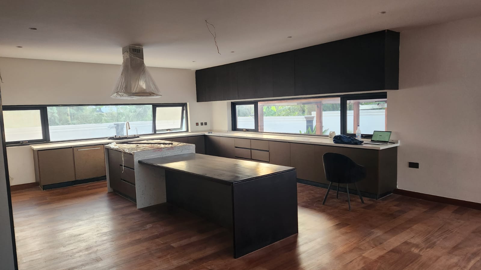 Kitchen showcase with fitted cabinetry and island